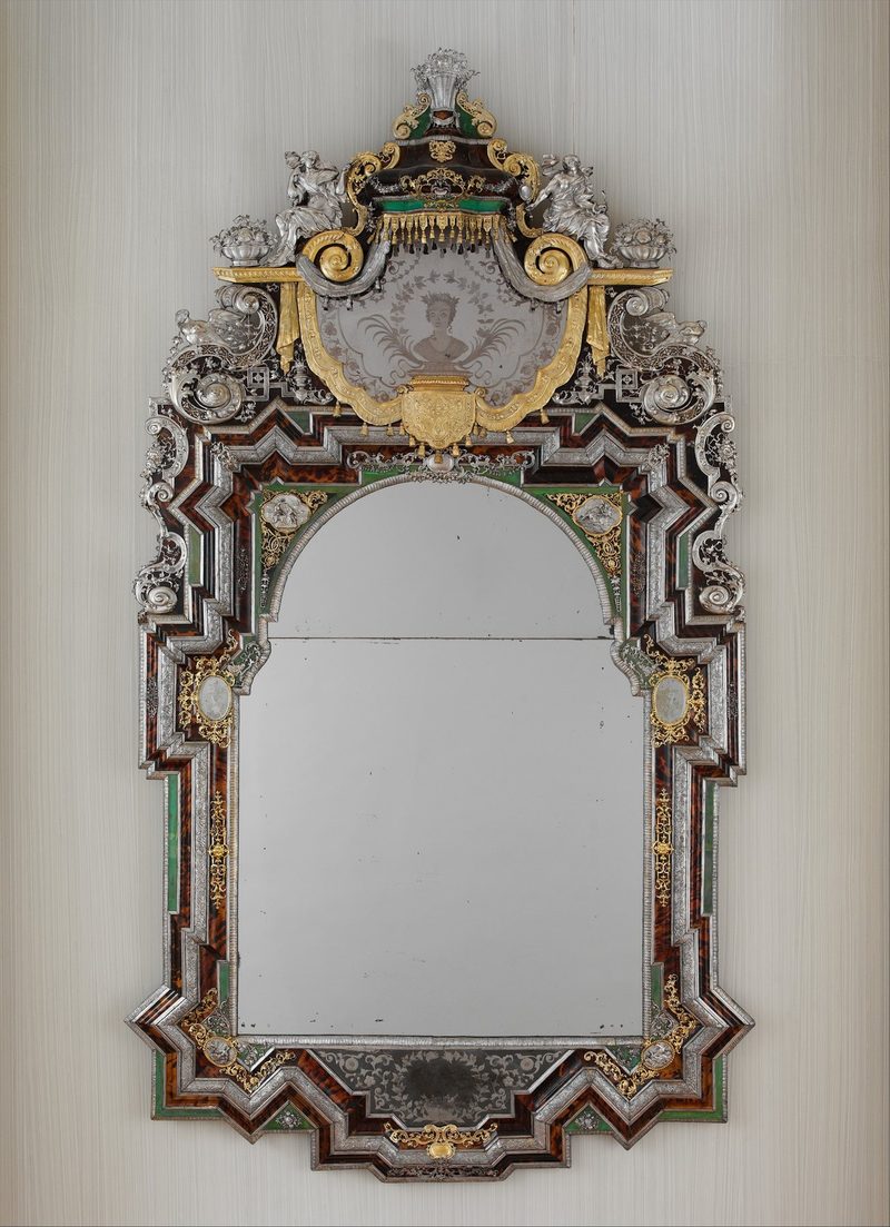 Mirror with an engraved-glass panelled frame