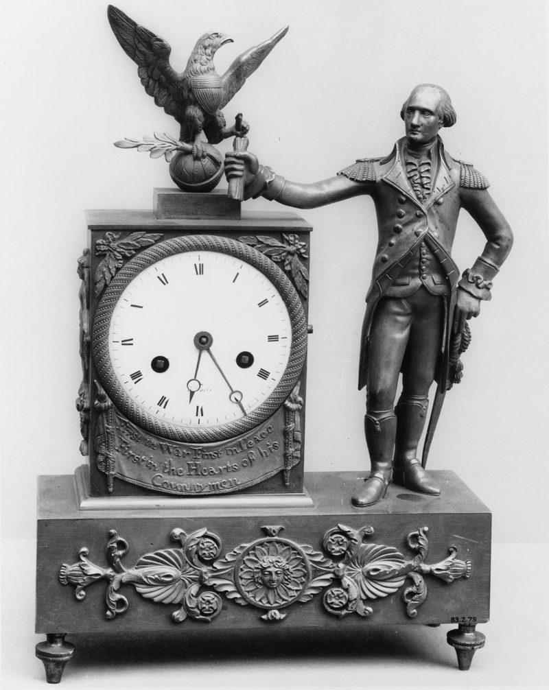 Orologio da camino in bronzo patinato con figura